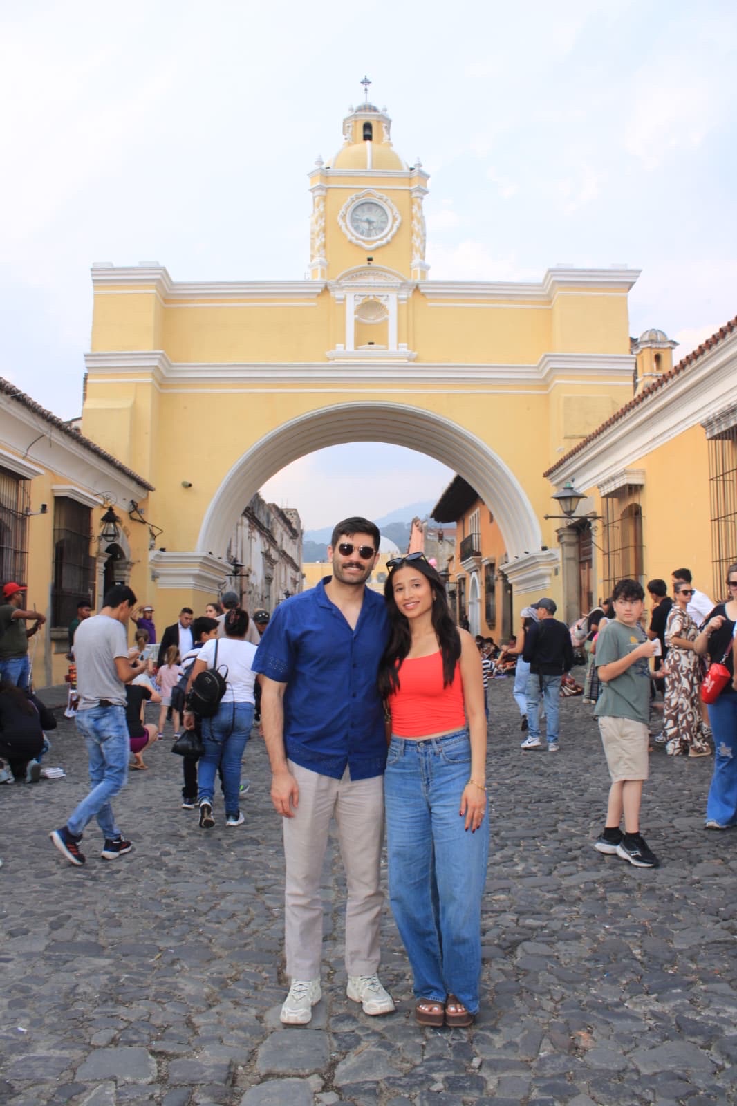 Big smiles on our first trip together to Guatemala under the iconic Arco de Santa Catalina